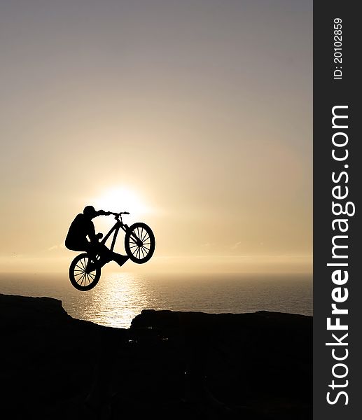 Sunset biker jumping