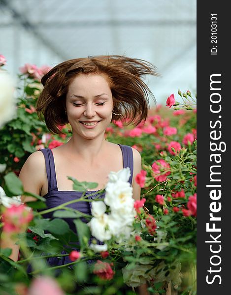 An image of a young lady in the garden. An image of a young lady in the garden
