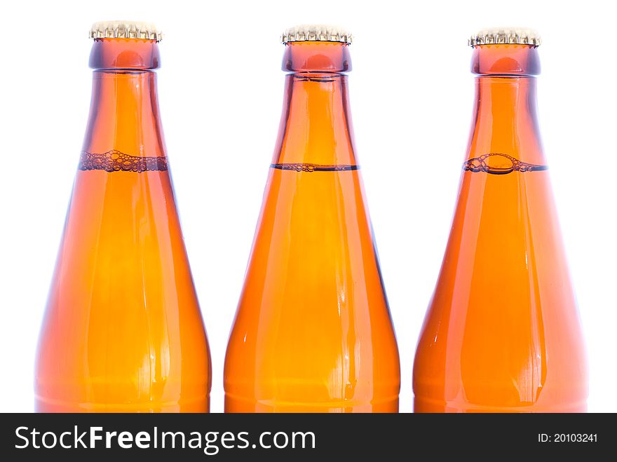 Three beer bottles isolated on white