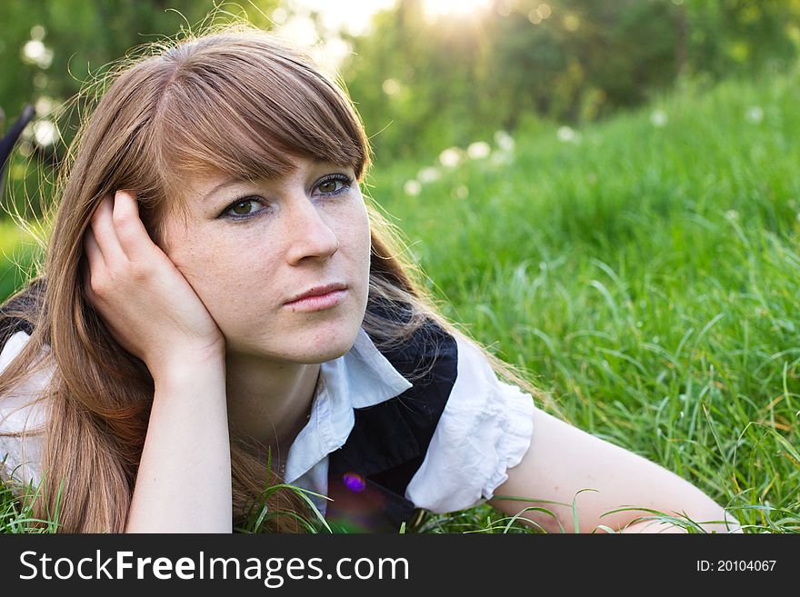 Single beautiful woman relaxing at the park. Single beautiful woman relaxing at the park