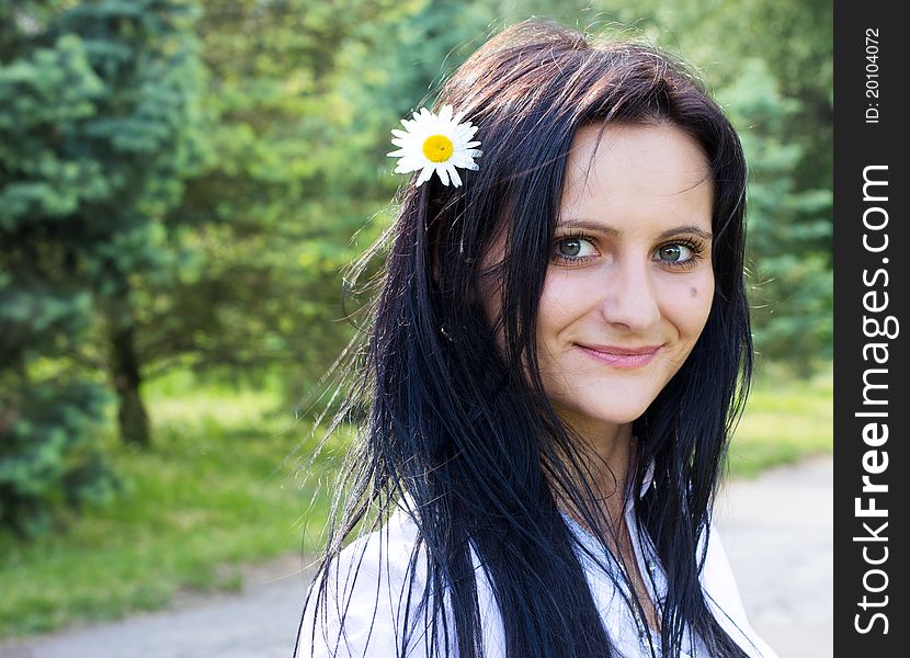 Beautiful Smiling Woman With Flower