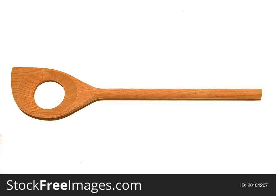 Wooden spoon with a hole, white background. Wooden spoon with a hole, white background