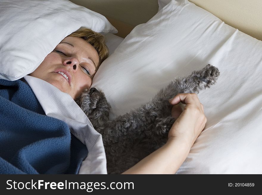 Woman asleep with her dog. Woman asleep with her dog