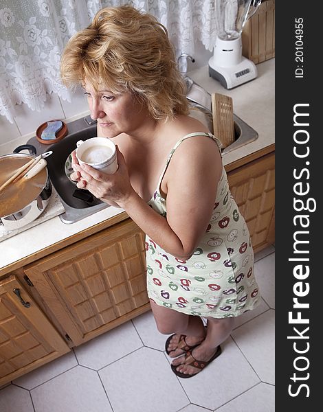 Woman waking up with a coffee (Dirty dishes)