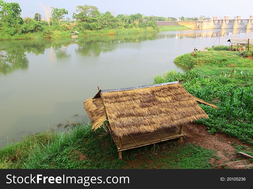 Bamboo hut and farmer's garden at riverside view