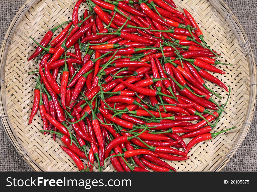 Fresh Red chili peppers on bamboo weave