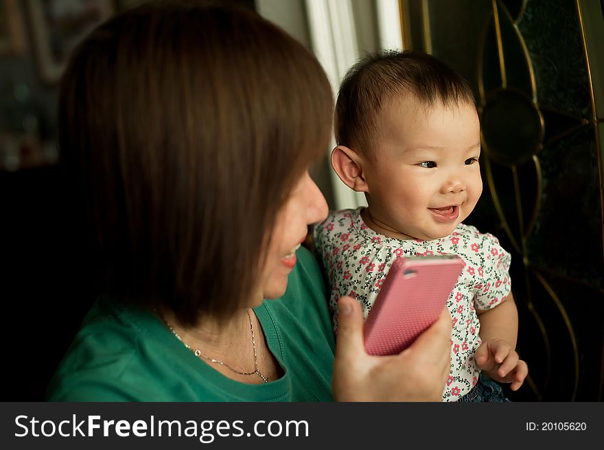 Grandmother and child smiling during a light moment