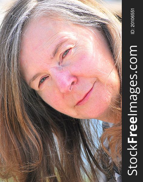 Mature female beauty expressions outdoors. Mature female beauty expressions outdoors.