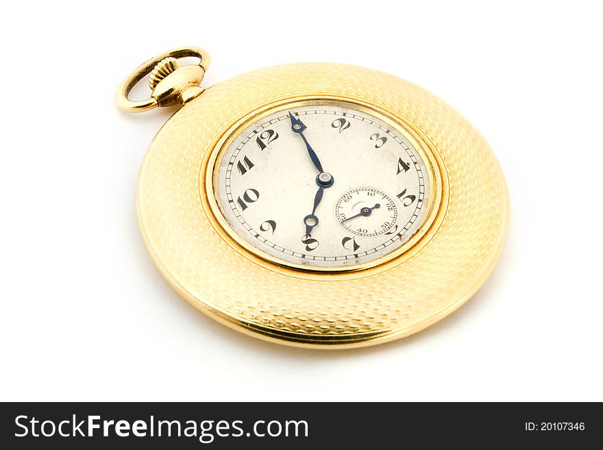 Gold pocket watch over white