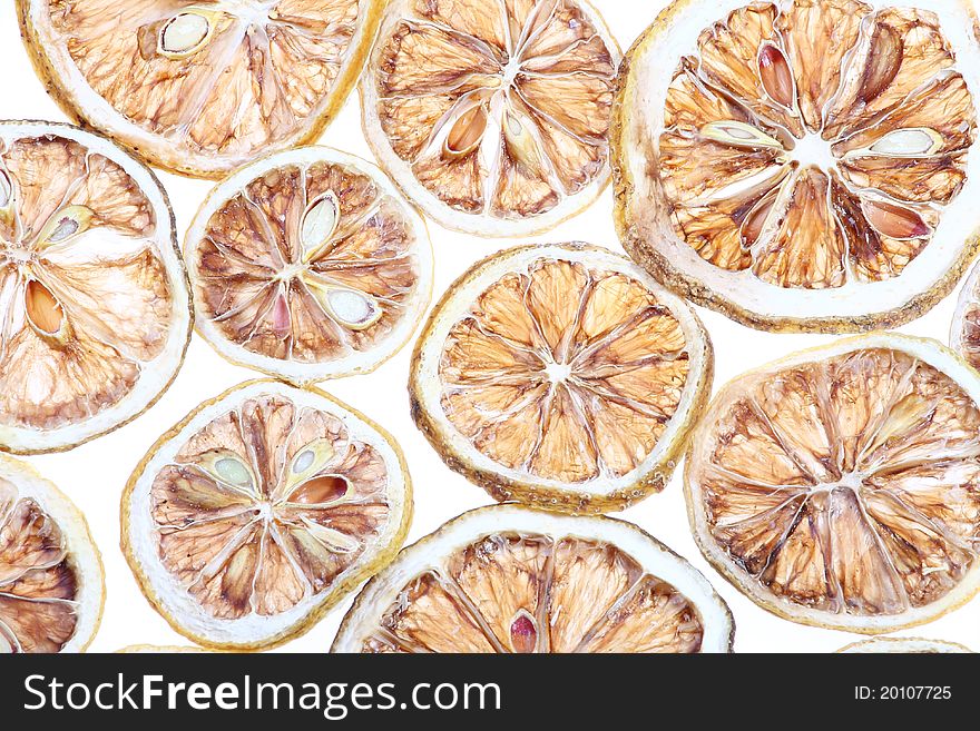 Desiccated citrus slice on white background. Desiccated citrus slice on white background