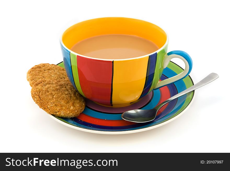 Stripy cup and saucer with two biscuits isolated on white. Stripy cup and saucer with two biscuits isolated on white