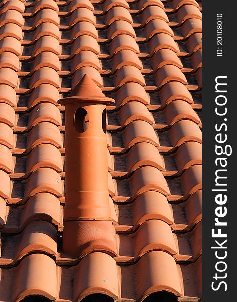 Tile roof with brick chimney