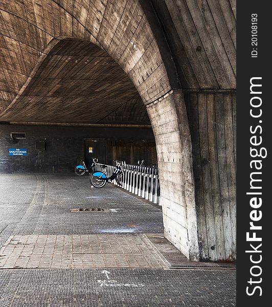 Public rental bicycle station under a bridge in London, UK. Public rental bicycle station under a bridge in London, UK