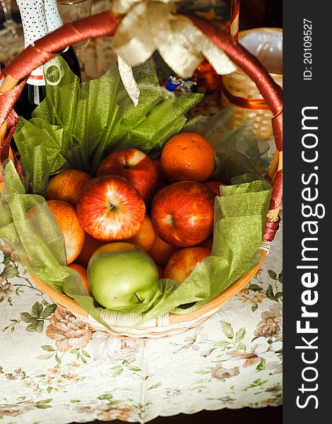 Basket for picnic with champagne and fruits