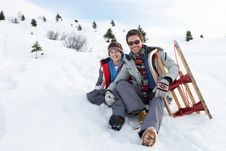 Young Father And Son In Snow With Sled Royalty Free Stock Images