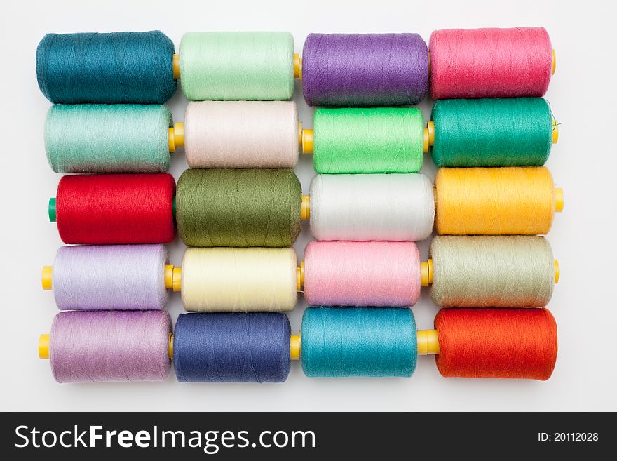 Cotton bobbins in a grid pattern - landscape interior. Cotton bobbins in a grid pattern - landscape interior.