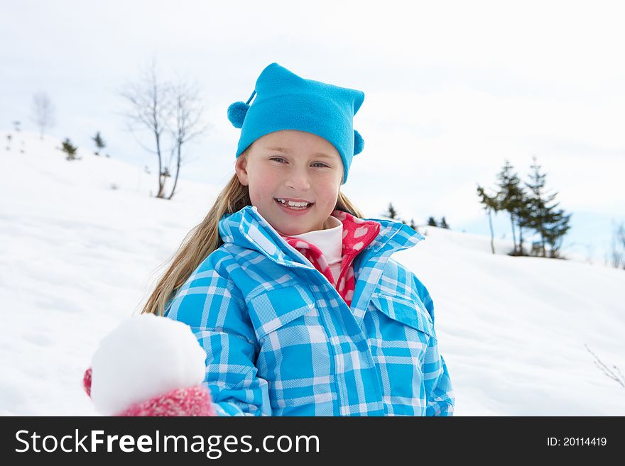 7 Year Old Girl On Winter Vacation smiling to camera