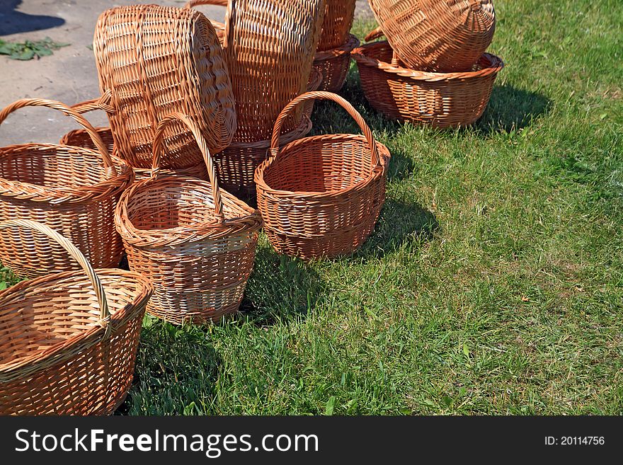 Brown baskets on green herb