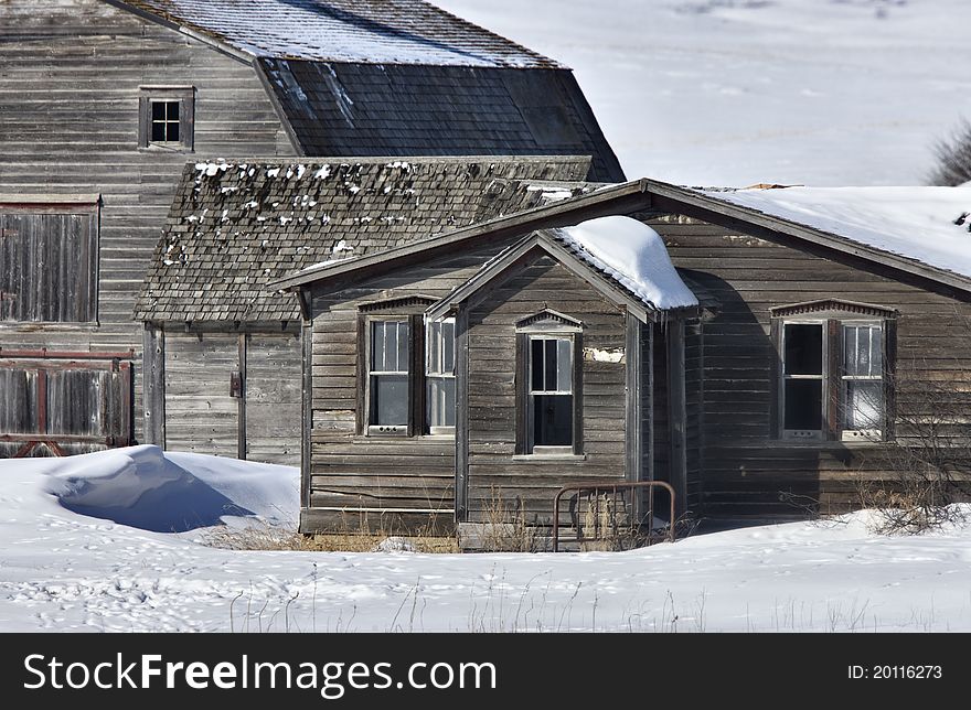 Old Granary and barn in winter Saskatchewan Canada