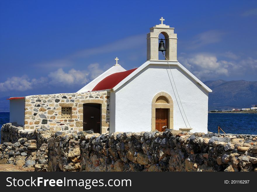 White greek chapel on the seashore. White greek chapel on the seashore