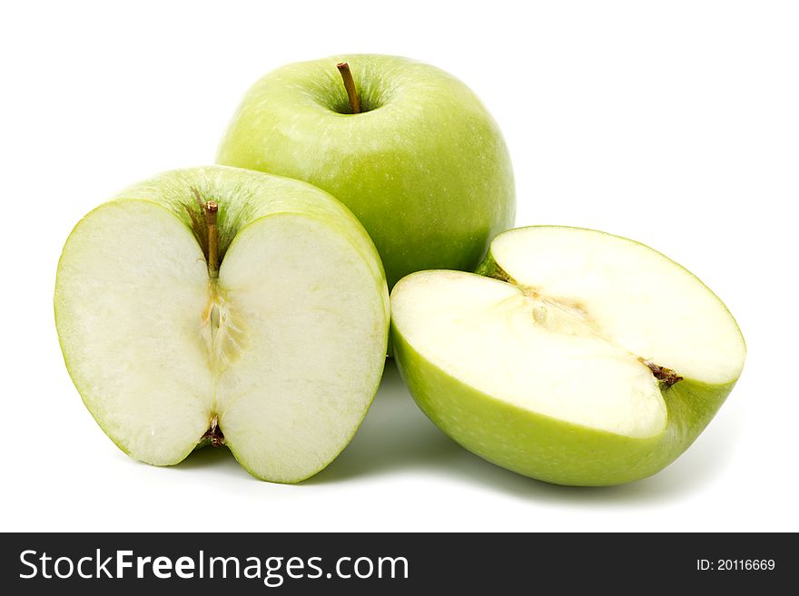 Green apple fruits and two halves of apple