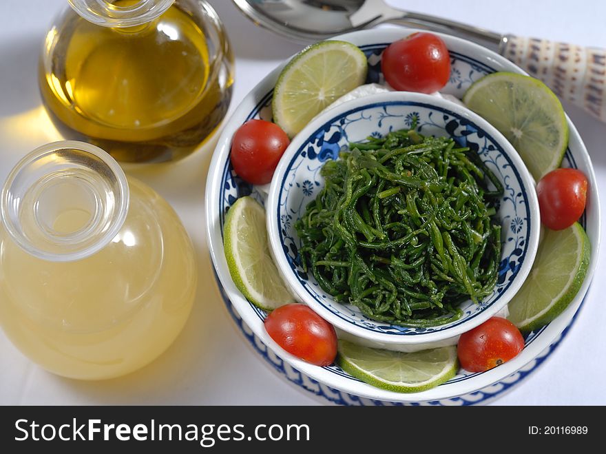 Boiled moss served with olive oil and lemon sauce. Boiled moss served with olive oil and lemon sauce