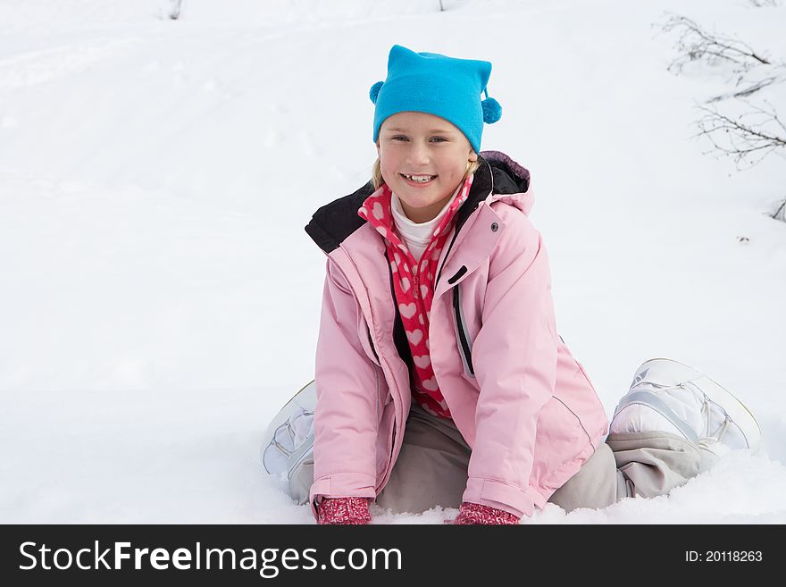 7 Year Old Girl On Winter Vacation smiling at camera