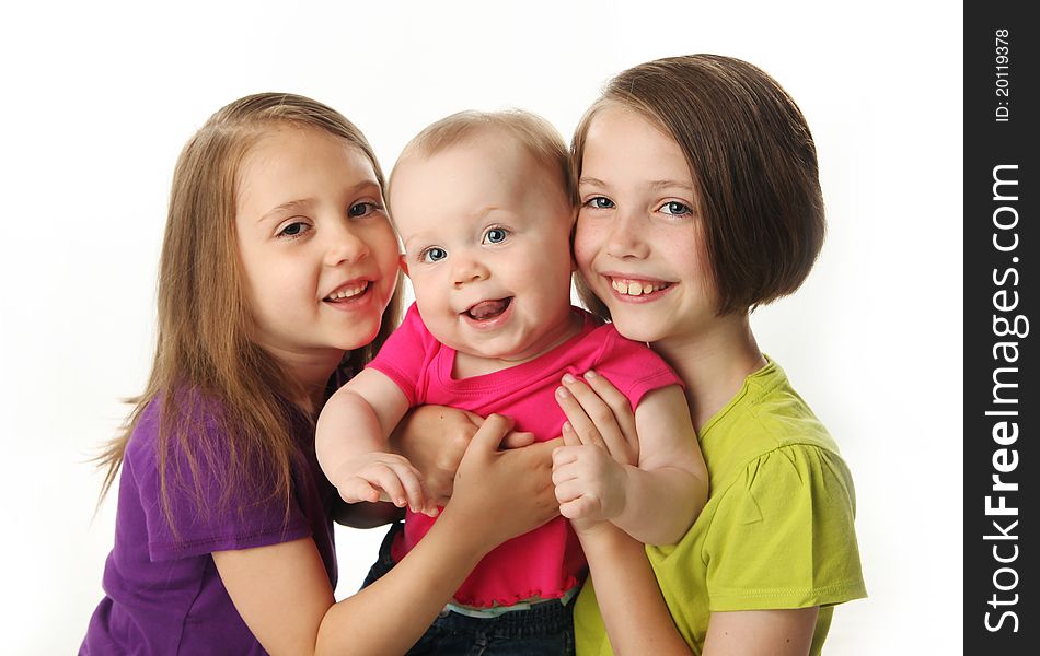 Three cute young sisters