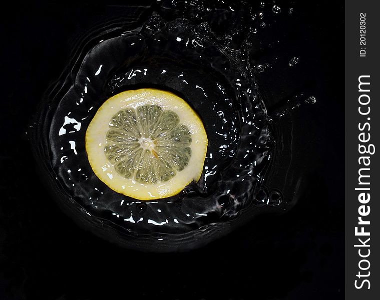 Lemon falling into the water. Lemon falling into the water