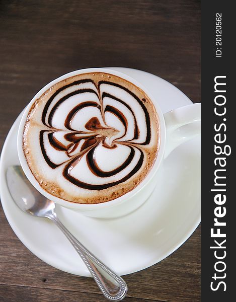 Cup Of Coffee On Wooden Table