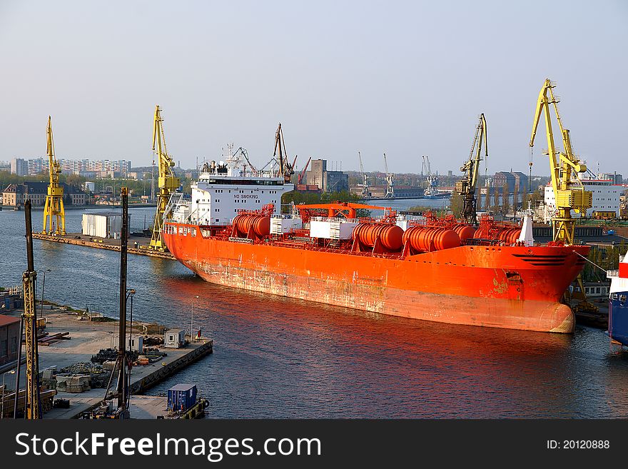 Chemical tanker ship waiting in the Gdansk Repair Shipyard in welding work