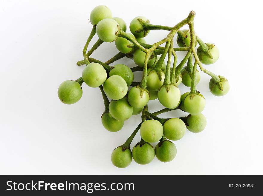 A few bunches of Thai brinjal placed on white background.