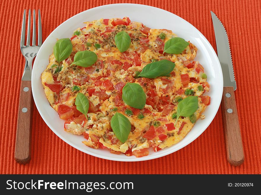 Omelet with vegetables and basil