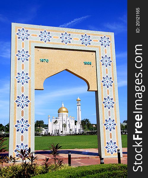 Concrete tiled structure of a monument to commemorate the changing of Brunei's capital name. Included in the design (middle part) is the shape of a mosque's dome as seen in the far background. Concrete tiled structure of a monument to commemorate the changing of Brunei's capital name. Included in the design (middle part) is the shape of a mosque's dome as seen in the far background.