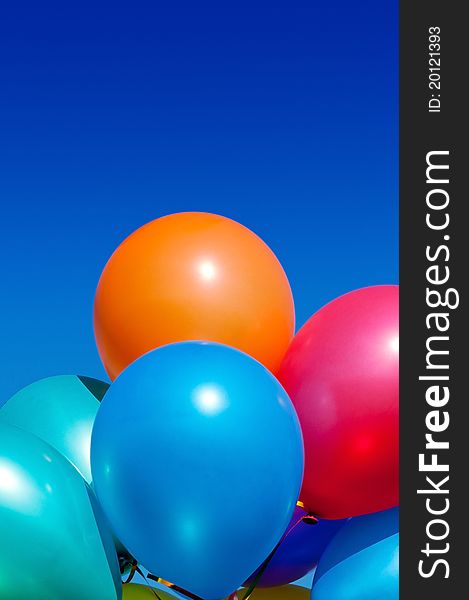 Bunch of colorful balloons in the blue sky