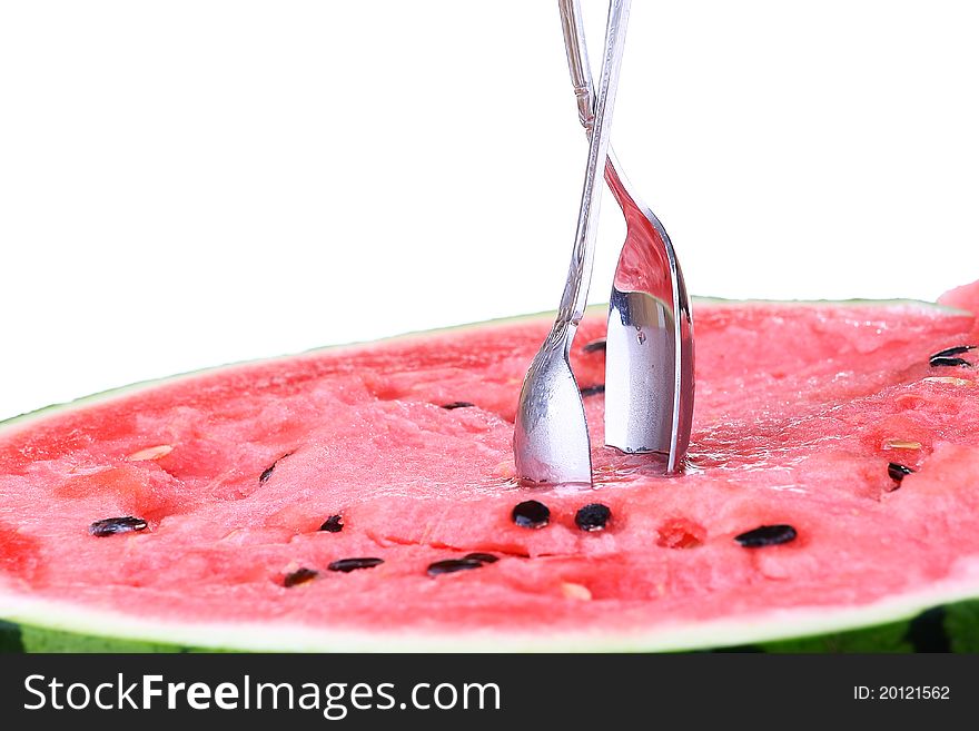 Watermelon with two scoops over white background