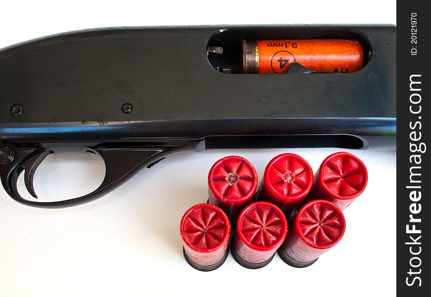 Cartridges on white background and in the gun. Cartridges on white background and in the gun.