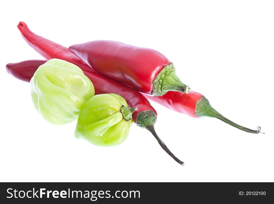 A selection of red & scotch bonnet chillis isolated against a white background. A selection of red & scotch bonnet chillis isolated against a white background