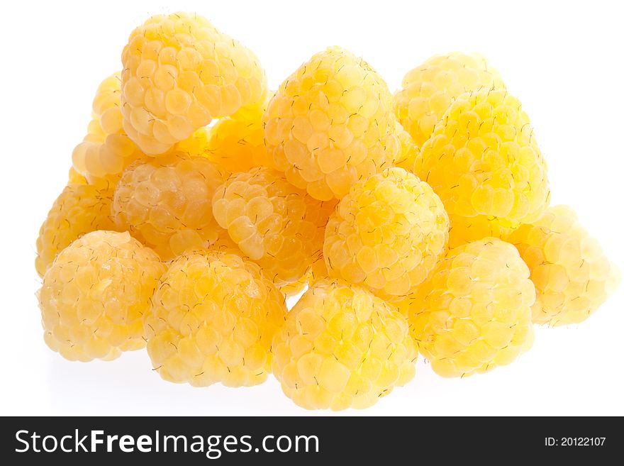 A selection of yellow raspberries isolated against a white background