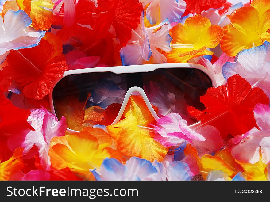 Sunglasses on flowerful lei. Celebrate your life and wear sunglasses at night. Sunglasses on flowerful lei. Celebrate your life and wear sunglasses at night