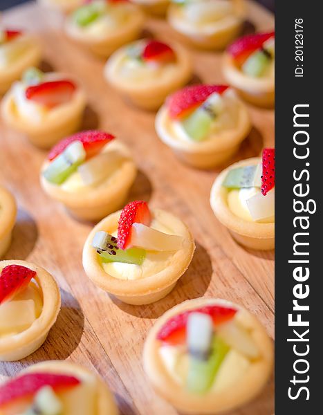 Beautiful strawberry pastry with fresh fruit.Very shallow depth of field. Beautiful strawberry pastry with fresh fruit.Very shallow depth of field.