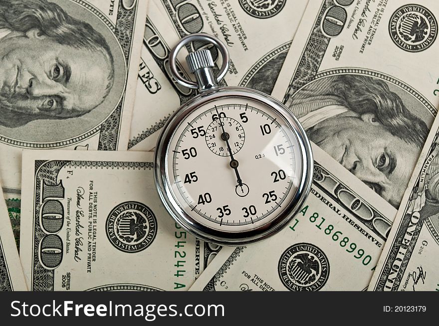 American dollars and stopwatch on a background