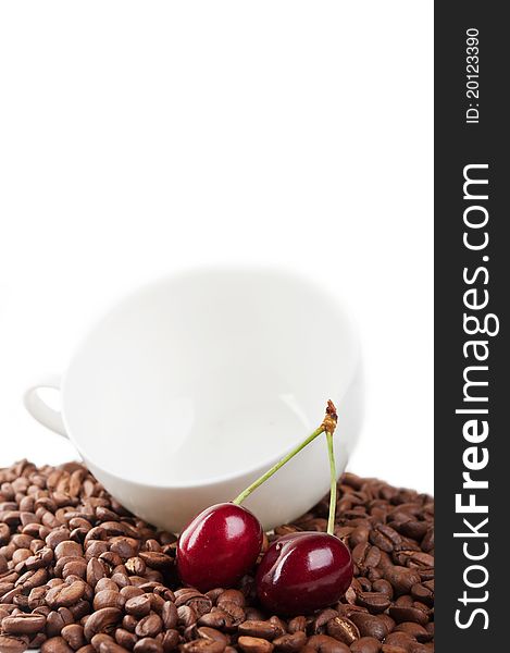 Cup with coffee beans and cherry isolated on a white background