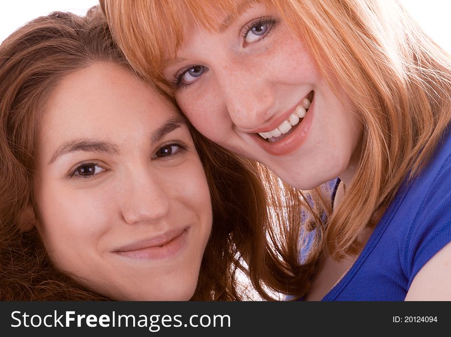 Two young girls wrapped thightly in front of the camera. Two young girls wrapped thightly in front of the camera