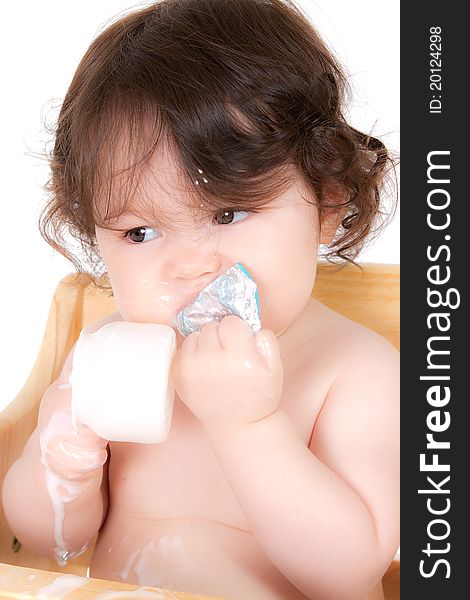 Baby enjoying a healthy snack. Baby enjoying a healthy snack