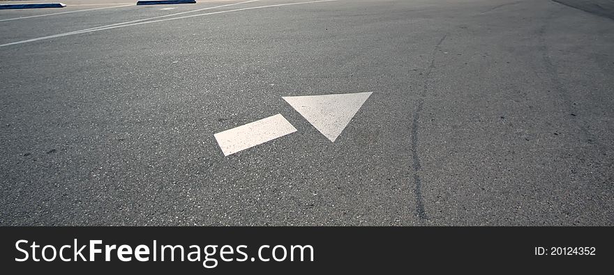 Directional arrow on the parking lot. Directional arrow on the parking lot.