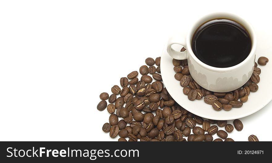 A cup of coffee with beans