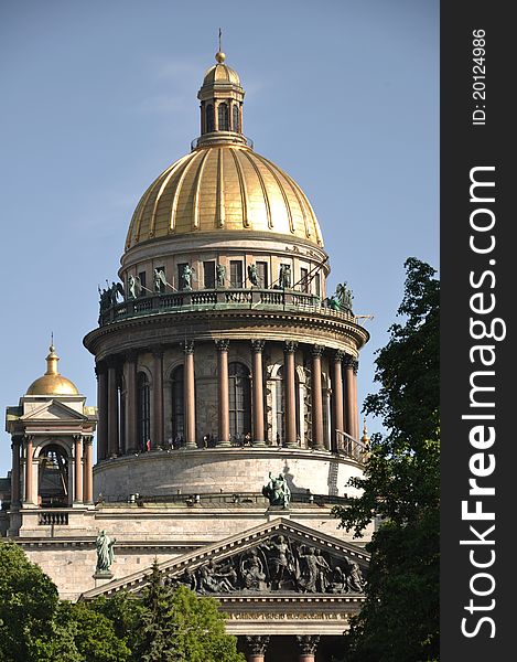 Sankt Petersburg landmark Isaac cathedral with columns and reliefs on a bright sunny day. Sankt Petersburg landmark Isaac cathedral with columns and reliefs on a bright sunny day