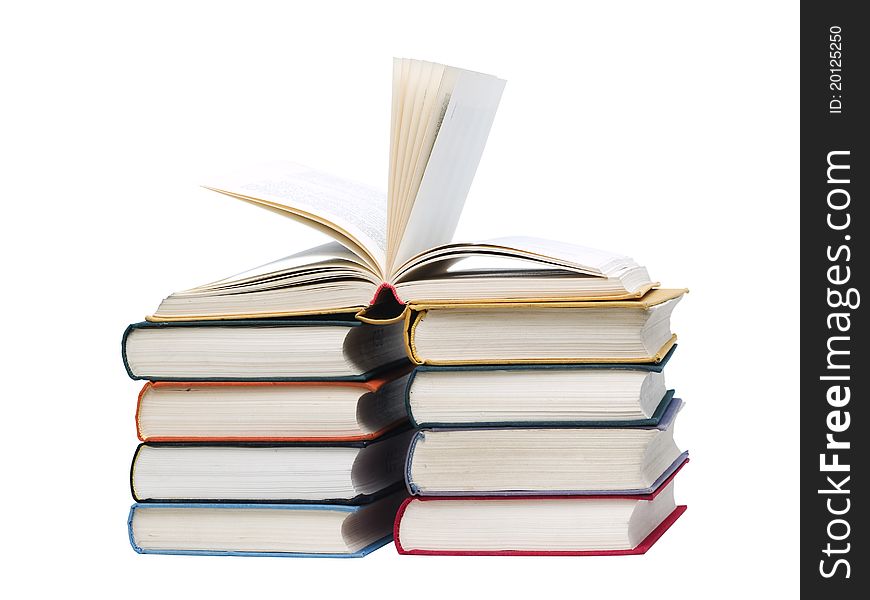 Stacked old books on white