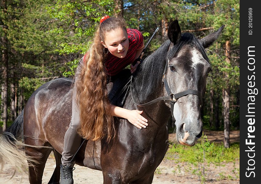 A Girl With Her Hair Stroking Horse